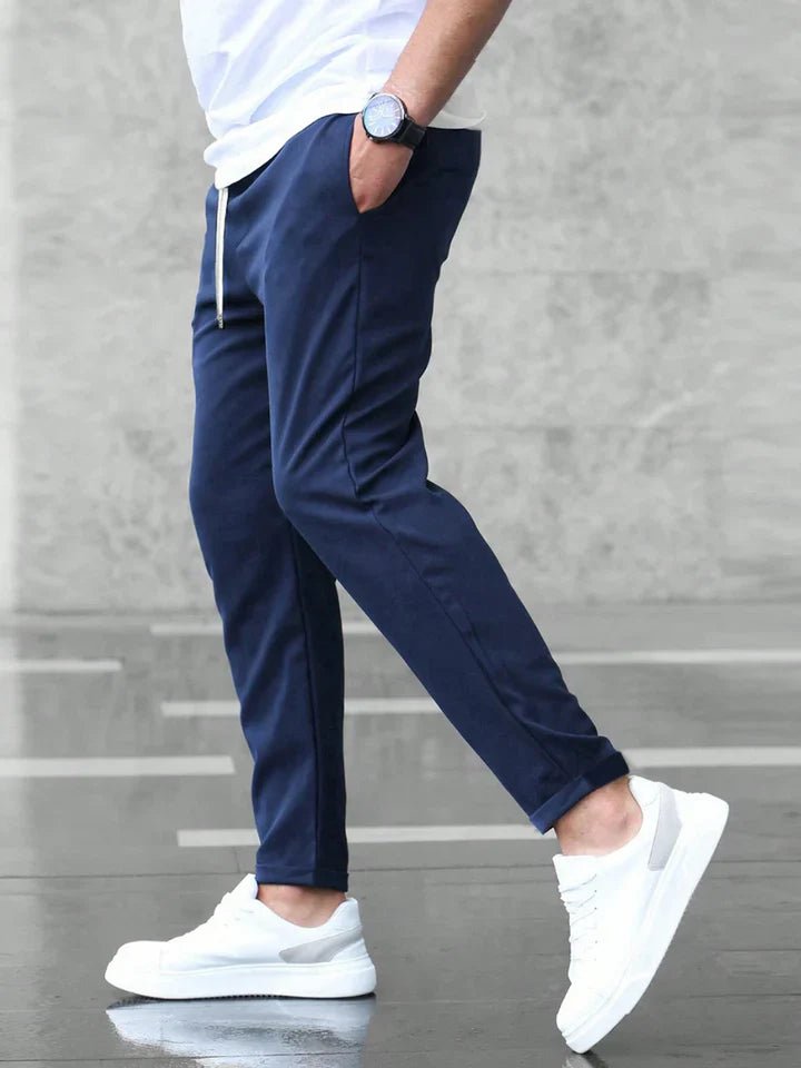 Slim-fit men's flexible chinos with drawstring, blending contemporary style and comfort.