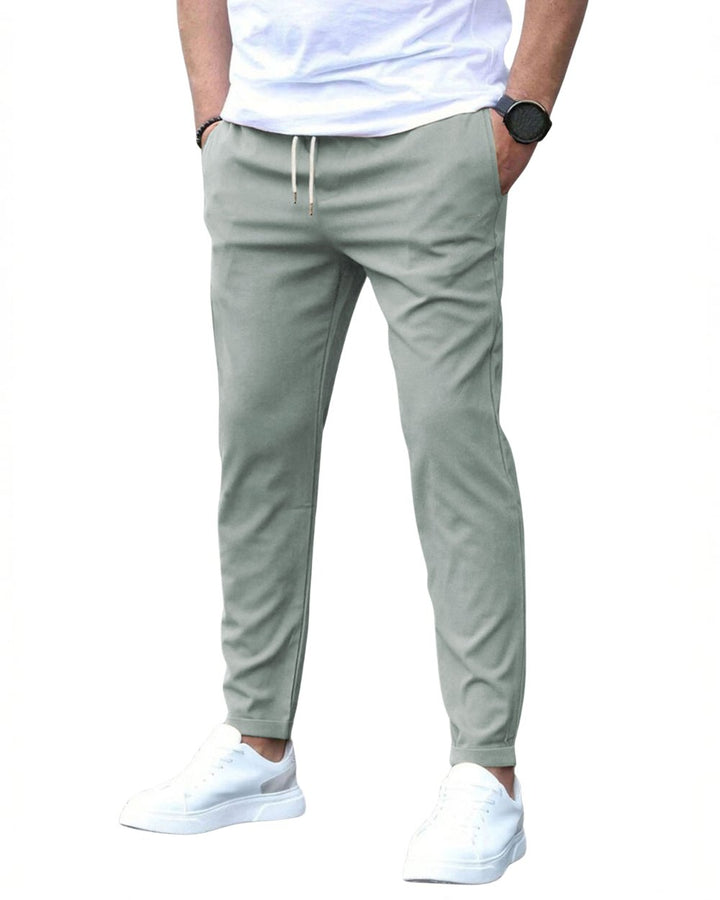 Flexible men's slim-fit chinos with adjustable drawstring for a custom fit.