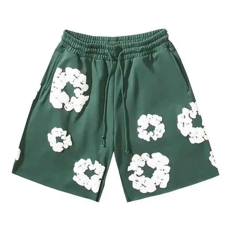 Trendy men's shorts featuring a bold floral print. Essential summer fashion for streetwear, festivals, and beach days.