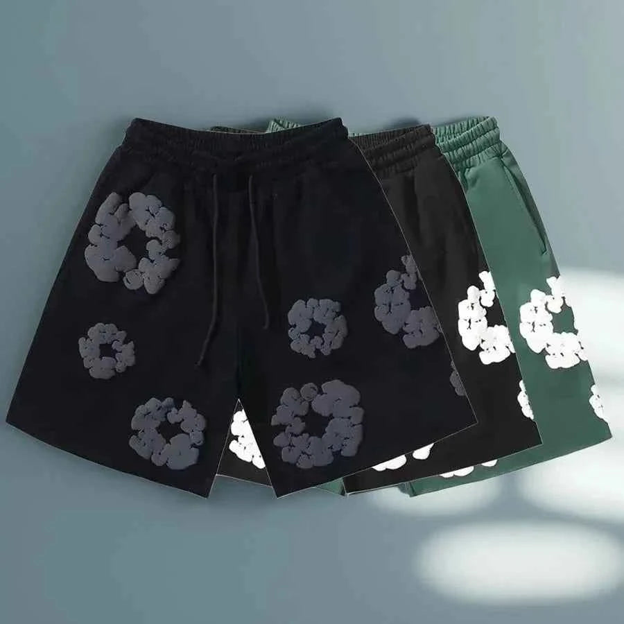 Comfortable men's summer shorts with a vibrant floral print. Ideal for casual wear, beach trips, or a bold festival look.