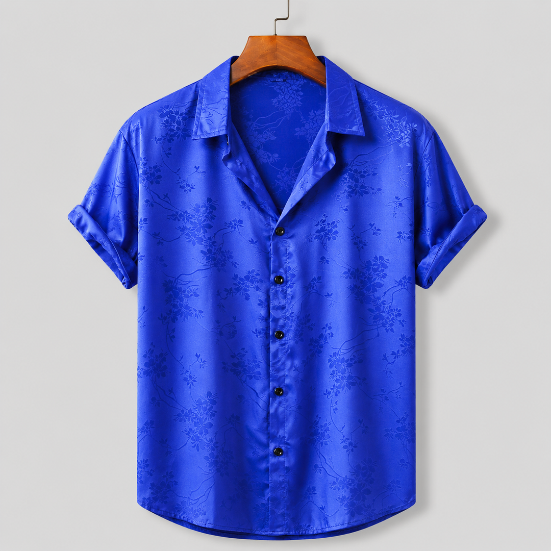 Stylish men's floral print polo, perfect for warm-weather casual wear & vacation outfits.