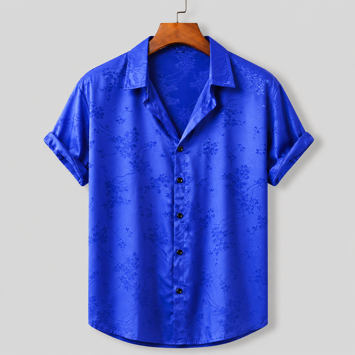 Stylish men's floral print polo, perfect for warm-weather casual wear & vacation outfits.
