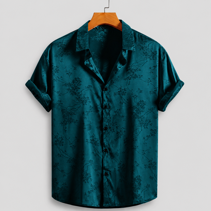 Satin feel men's floral print polo shirt with classic button-front for elegant summer style.