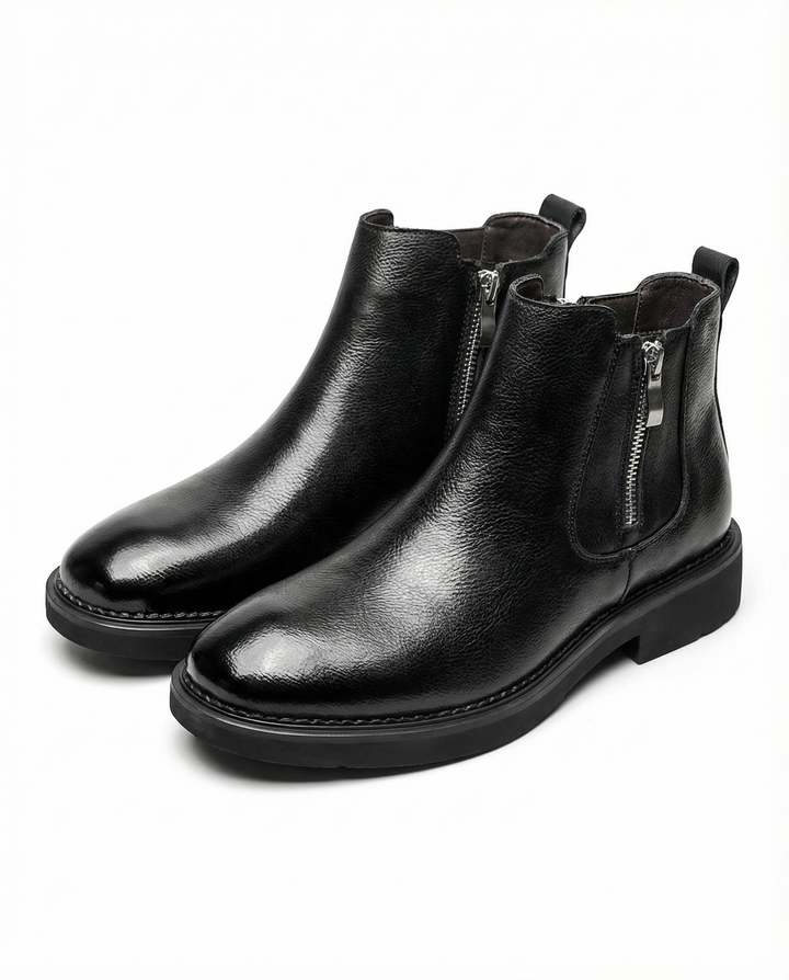 Elegant black full-grain leather ankle boots for men, featuring a sleek design and practical side zip, ideal for everyday wear