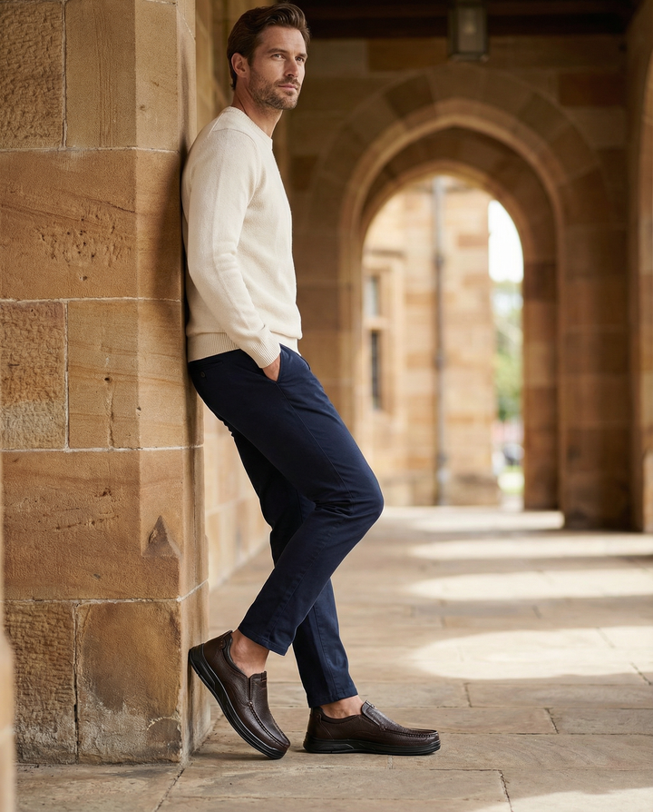 Close-up of men's slip-on leather loafers in black, showcasing fine genuine leather texture