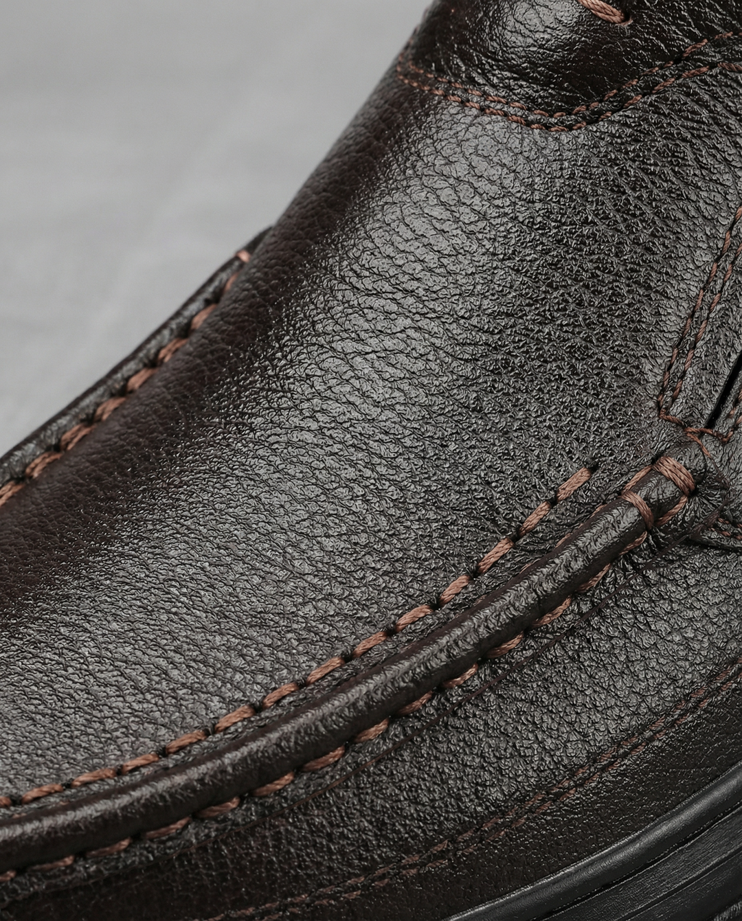Front view of men's black genuine leather slip-on loafers, a classic choice for mens fashion