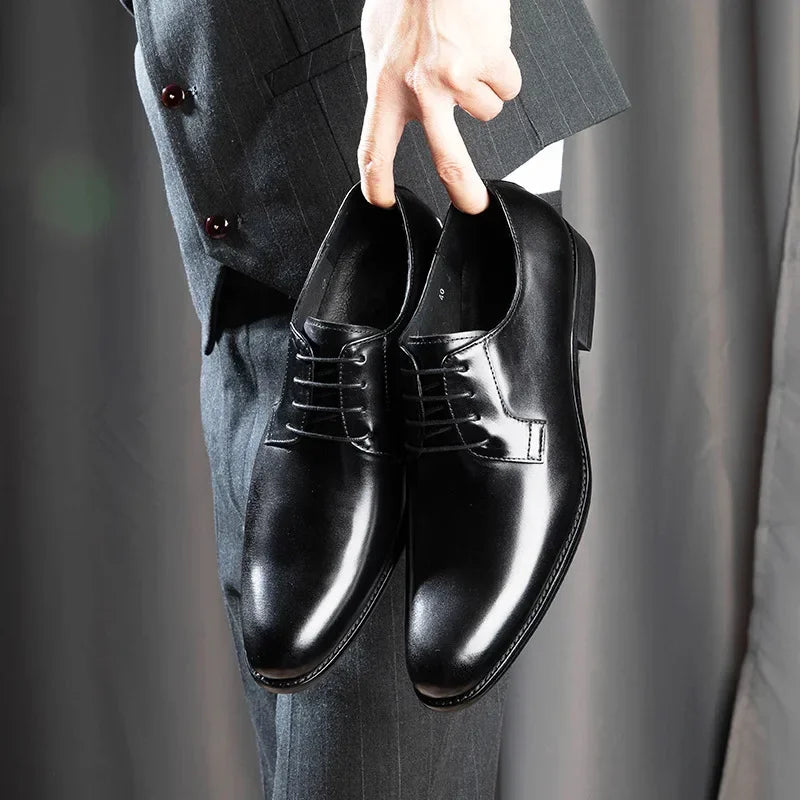 Stylish men's leather dress shoes in brown, ideal for business and formal events, comfortable design.