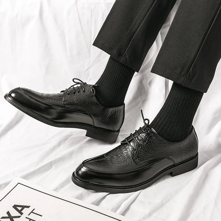 Top down view of men's formal Oxford shoes, high-quality genuine leather, showcasing expert craftsmanship.