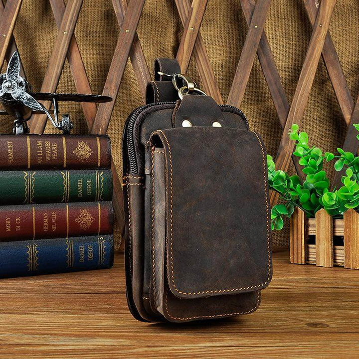Men's durable leather waist bag, cross-body style for secure, hands-free access.