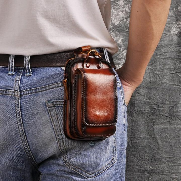 Genuine leather waist pack for men, dark brown, secure storage travel accessory.
