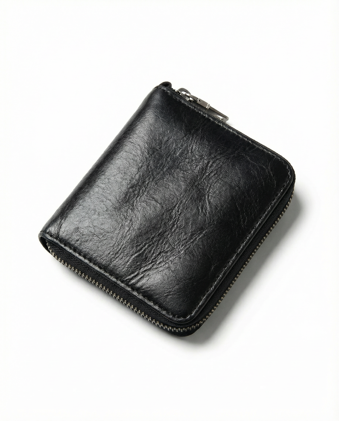 Close-up of the textured genuine leather of a men's zip wallet