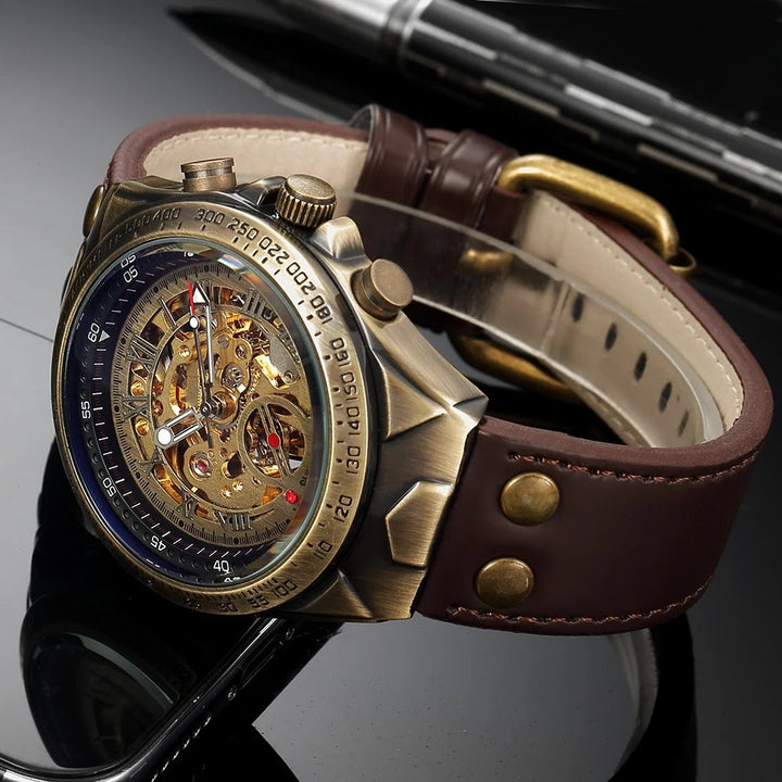 Gold automatic men's watch with see-through skeleton dial and black genuine leather strap on a wrist