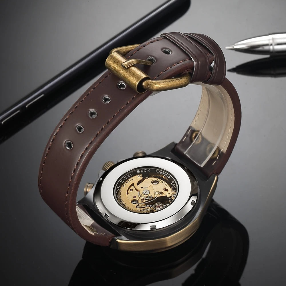 Elegant men's mechanical watch, gold-toned, featuring a captivating skeleton dial and leather strap