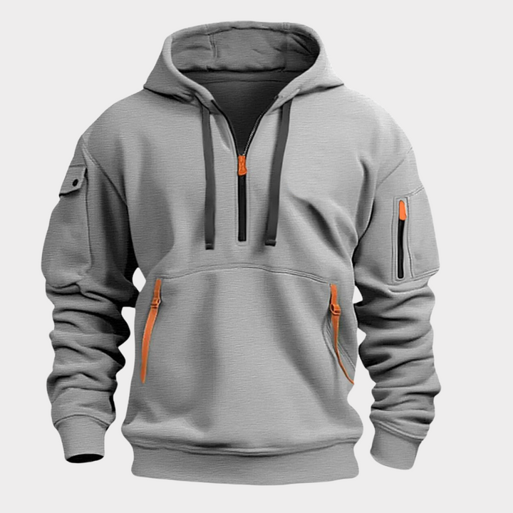 Modern men's half-zip hoodie for casualwear. Features an adjustable collar and practical pockets for everyday use.
