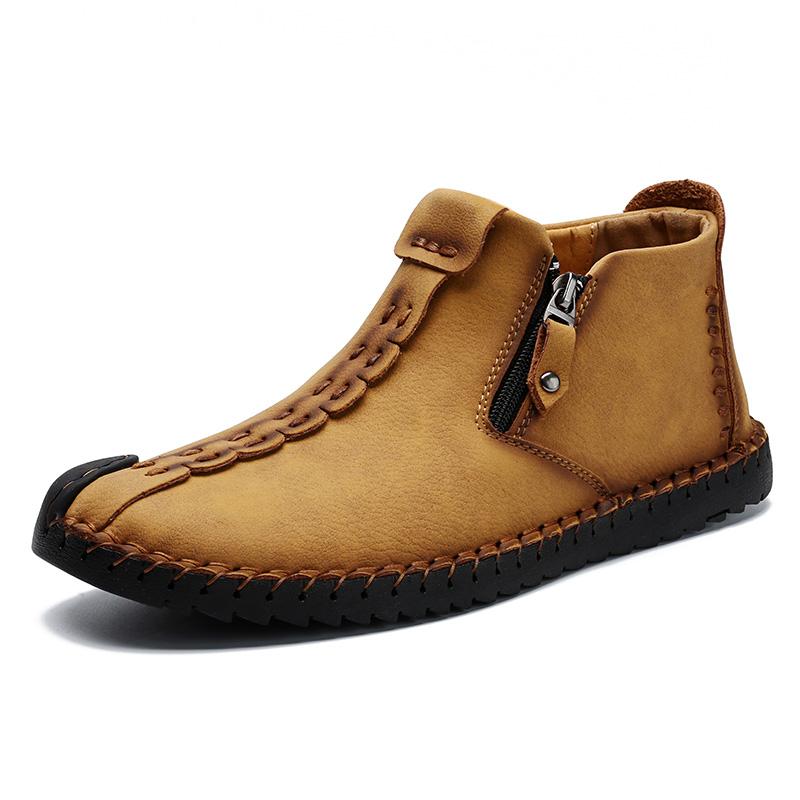 Close-up of non-slip sole on men's hand-stitched casual brown leather ankle boot