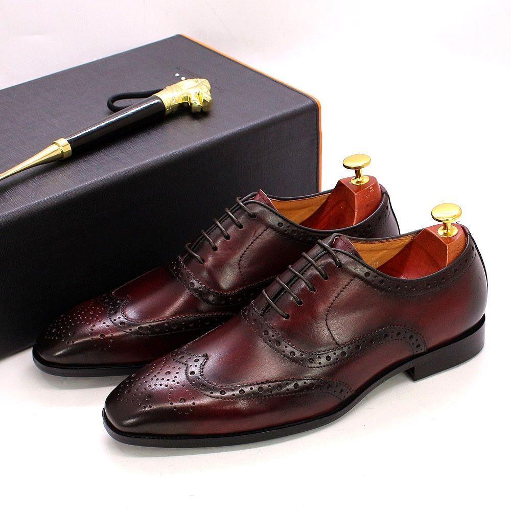 Men's handcrafted leather Oxford dress shoes, classic wingtip brogue style for formal & business wear.