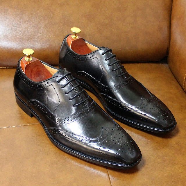 Elegant men's wingtip brogue Oxford shoes, handcrafted from premium leather for professional office attire.