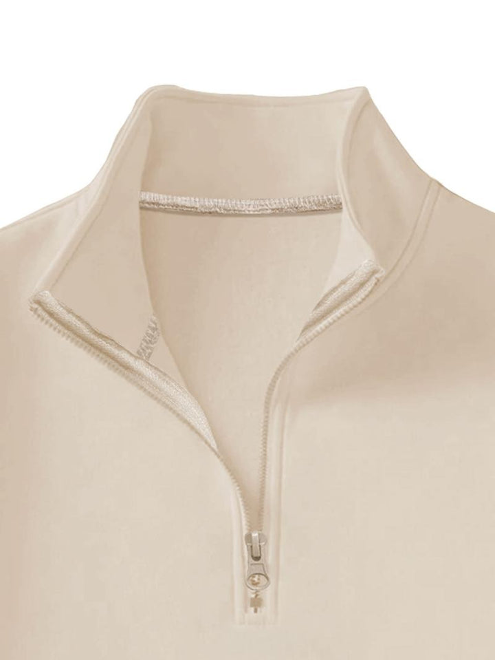 Folded blue men's modern half-zip fleece sweatshirt, highlighting its soft texture and quality