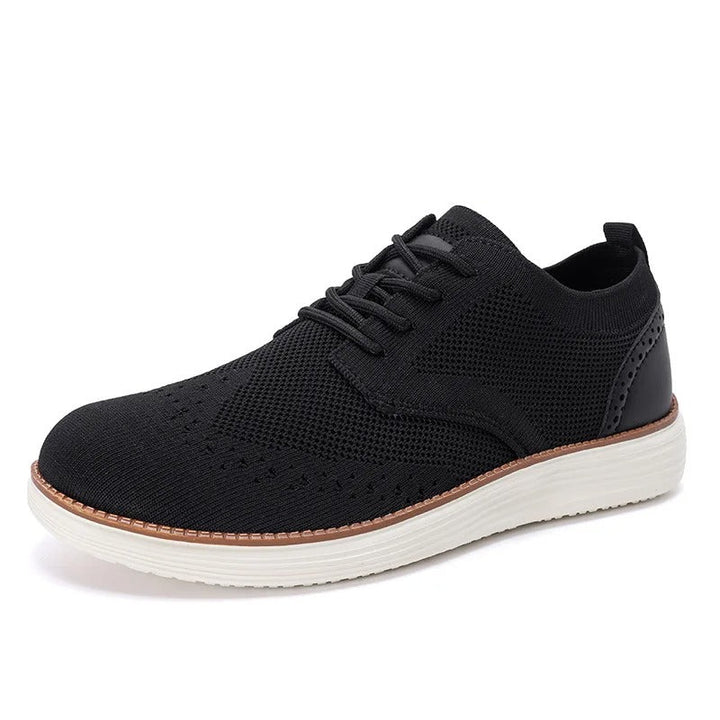 A man wearing men's hybrid dress sneakers, demonstrating their stylish fit for both casual and formal attire.