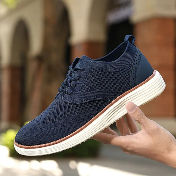 Formal yet casual men's hybrid shoes with a classic wingtip and contemporary sole for versatility.