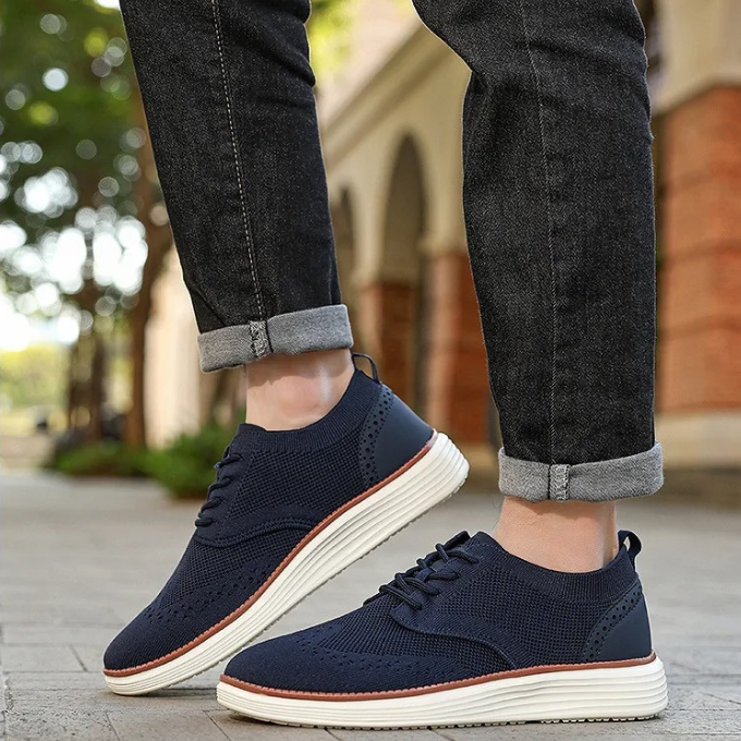 High-angle view of men's hybrid dress sneakers, emphasizing their sleek profile and textured knit.