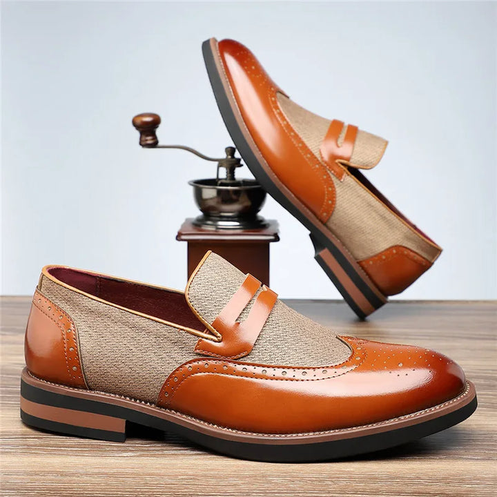 White background studio shot of men's hybrid wingtip loafers, highlighting product features