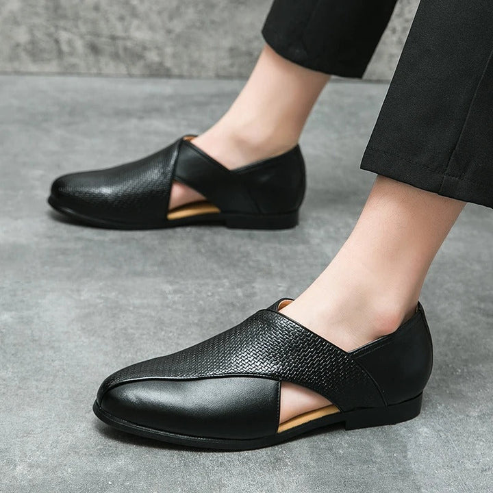 High-angle shot of men's woven leather loafers, displaying their refined Italian design