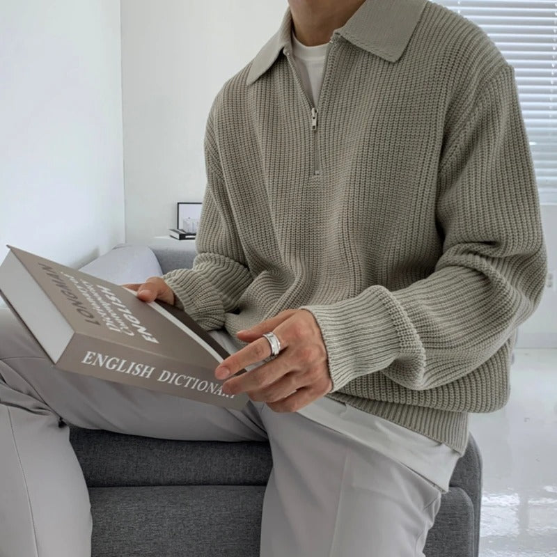 Man modeling a versatile jacquard knit quarter zip sweater, showcasing its comfortable fit and style.