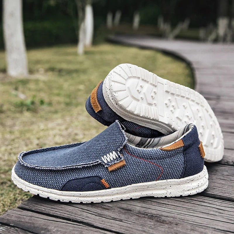 Collection of men's canvas slip-on shoes in various colors: khaki, blue, gray