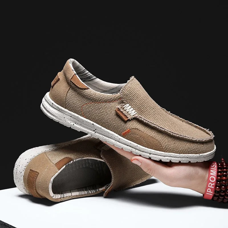 Underside view of a men's canvas slip-on shoe sole, highlighting grip