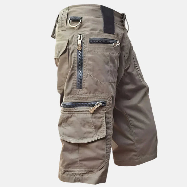 Relaxed fit men's utility cargo shorts, knee-length for everyday comfort & spring/summer fashion. Great for casual wear.