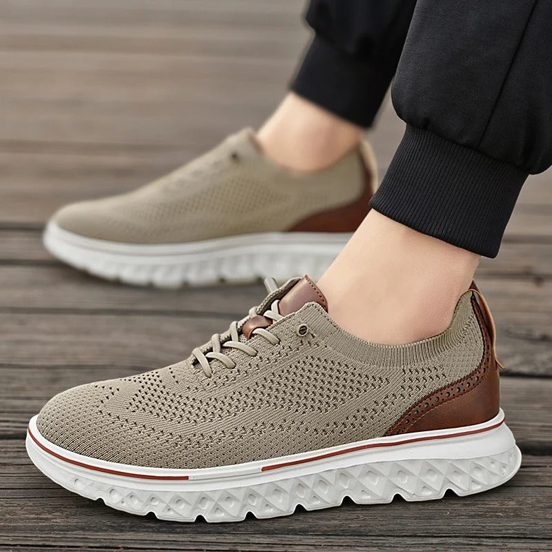 Breathable men's knit dress shoes with brogue accents, suitable for smart casual outfits.