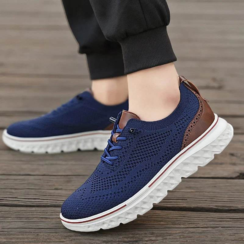Men's casual brogue knit sneakers in a rich navy, offering a blend of flexibility and sophistication.