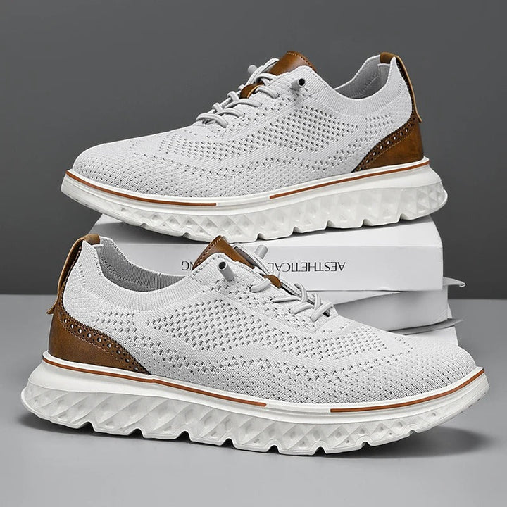 Side view of men's knit dress sneakers showcasing brogue patterns and a comfortable sole.