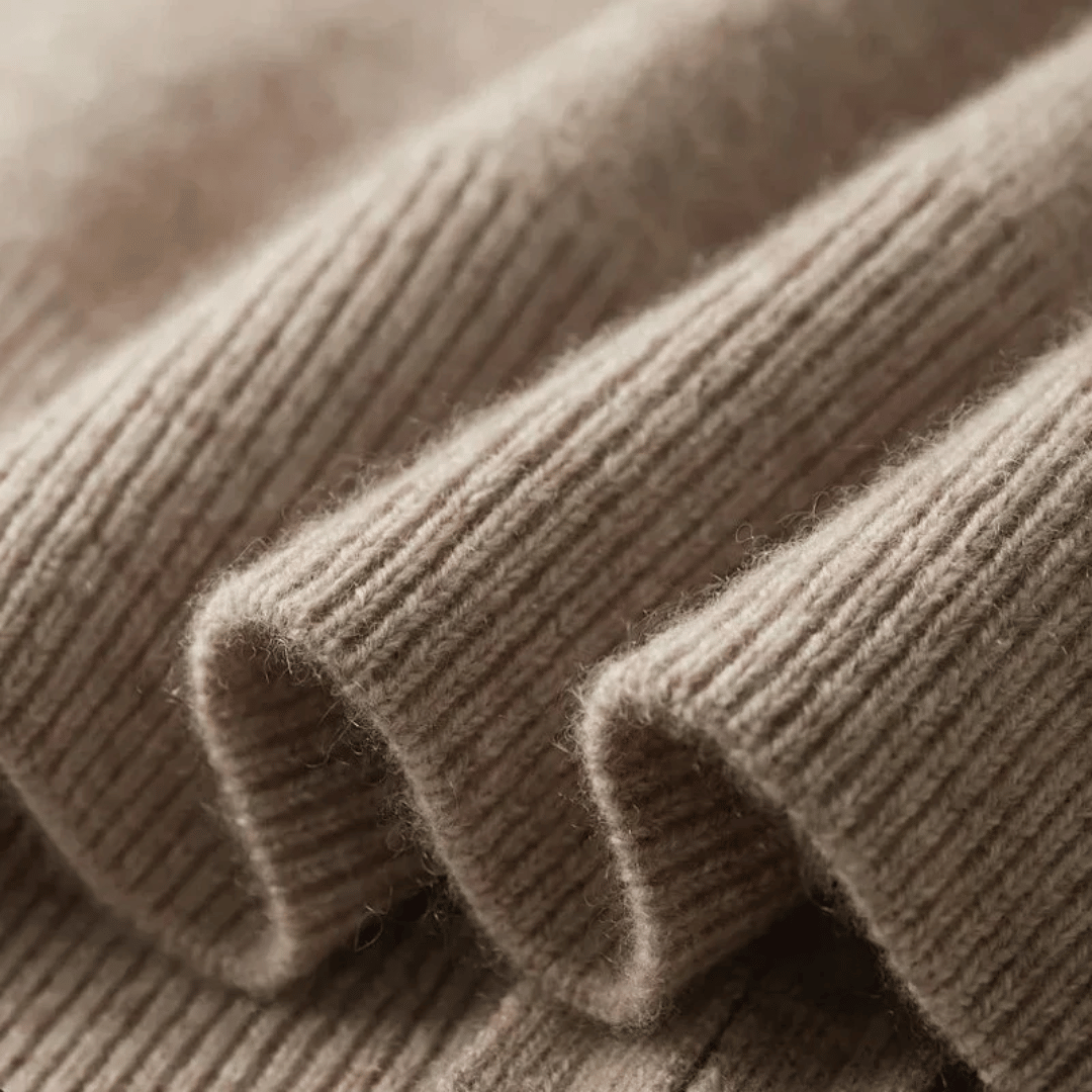 Full view of a men's knit zip-up cardigan. Long-sleeve, collared design for stylish layering.