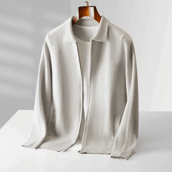 Close-up of the knit texture on a men's zip-up cardigan. Collared, long-sleeve for comfortable wear.