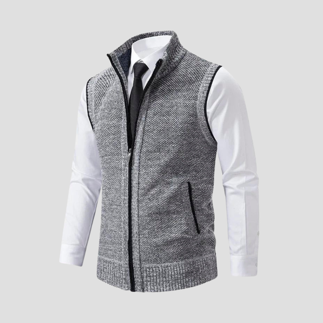 Close-up of a men's knitted gilet showing fine knit texture, durable zip front, and stylish contrast trim detail.