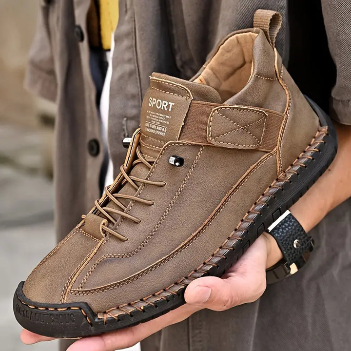 Men's black leather orthopedic slip-on shoes, designed for easy wear and superior foot support.