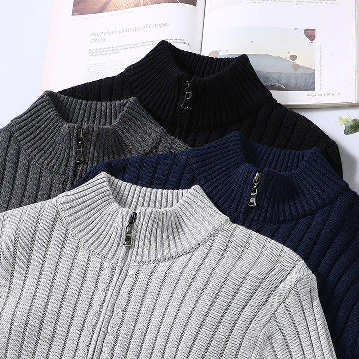 Flat lay of men's ribbed knit zip sweater in light gray, detailing the zipper and fabric