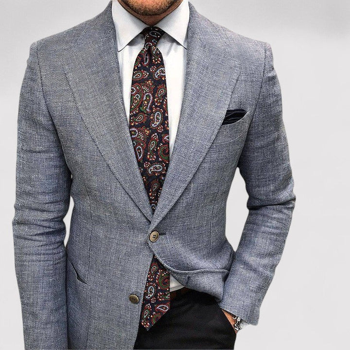 Tailored men's slim fit blazer. This stylish jacket is ideal for smart casual, business, or formal fashion attire.