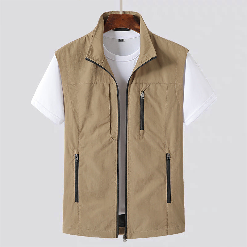 Versatile men's lightweight vest, sleeveless design with ample pockets for comfortable summer travel & outdoor layering.