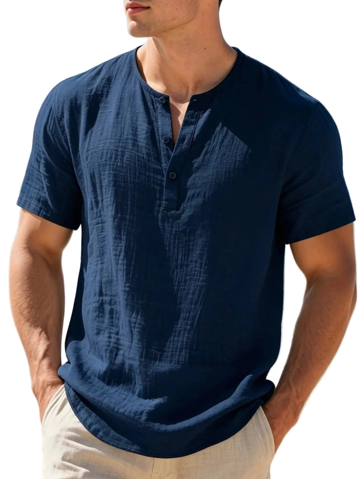 Stylish men's short-sleeve Henley top, ideal for beach outfits, holiday wear, and warm weather comfort.