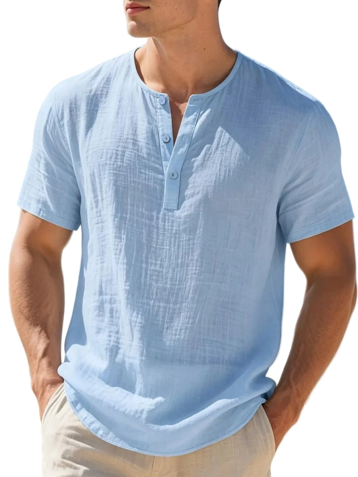 Casual men's Henley shirt in a soft, lightweight fabric, ensuring breathability and cool comfort all summer long.