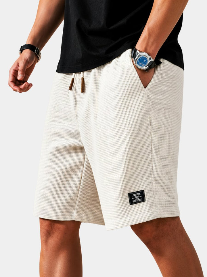Men's lightweight summer waffle shorts with elastic waist & drawstring for ultimate comfort & casual style.