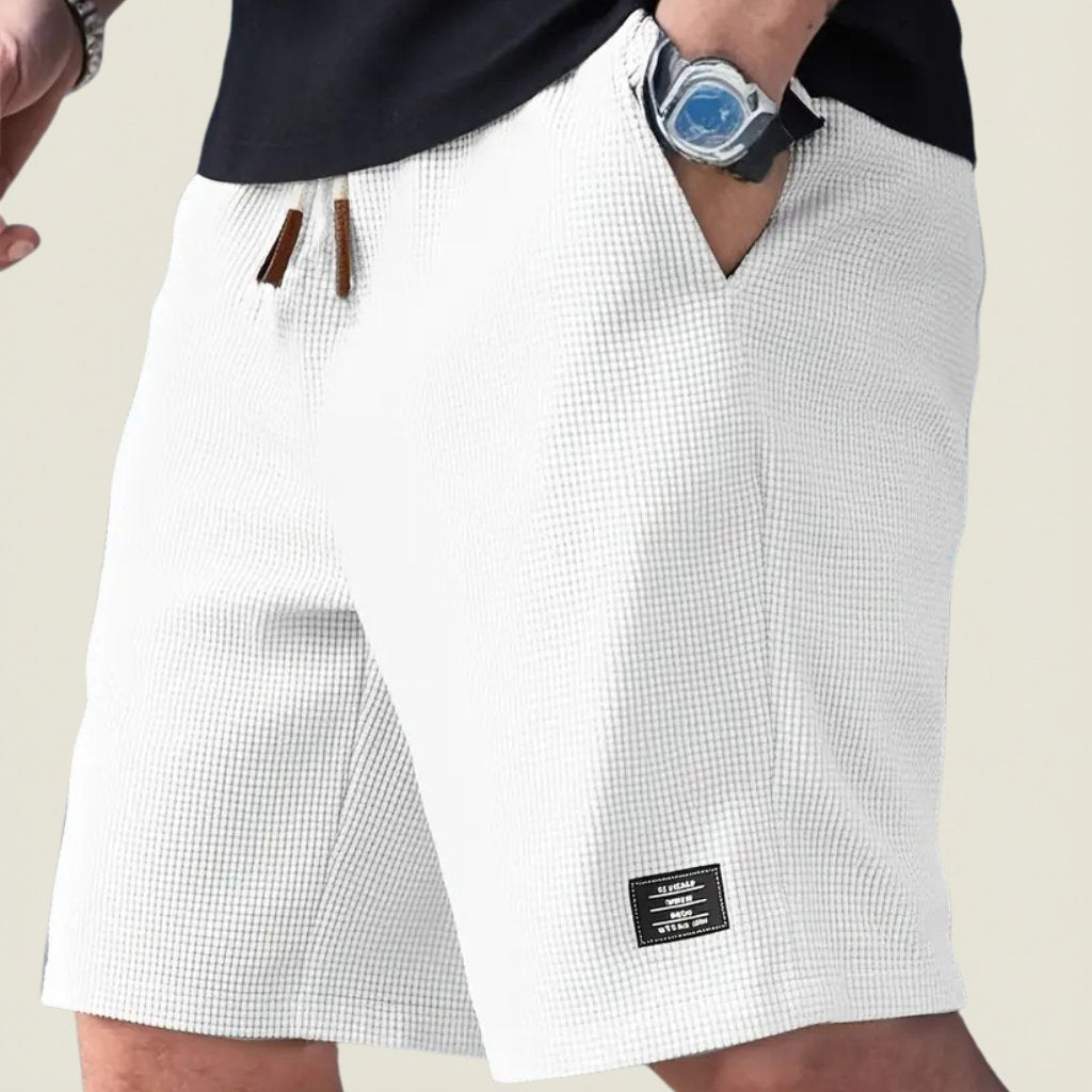 Men's lightweight summer waffle shorts. Elastic waist, drawstring for ultimate casual comfort.