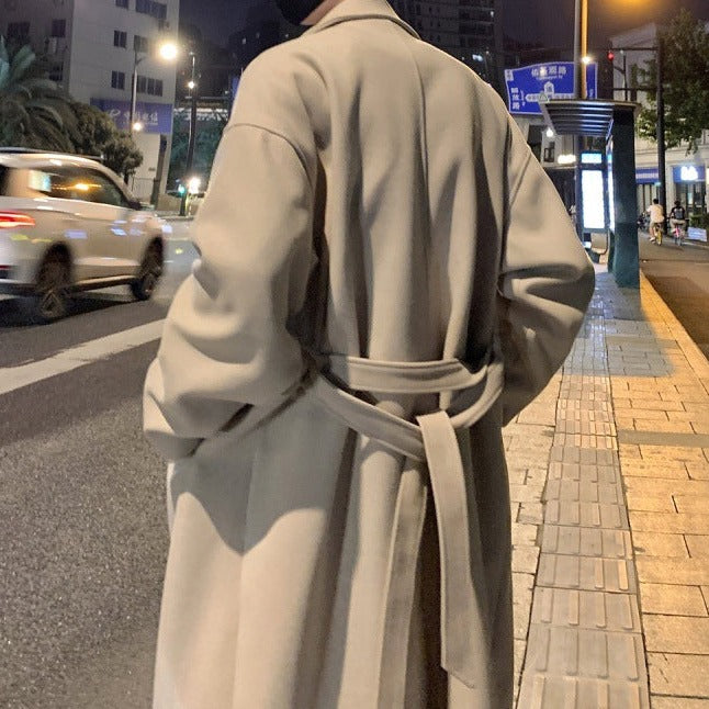 Classic men's belted long trench coat, a versatile outerwear piece for elegant formal and casual styles.
