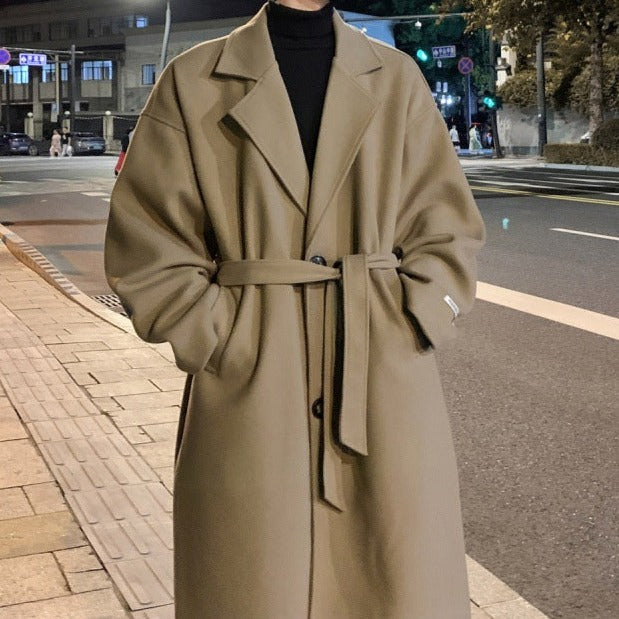 Stylish men's winter overcoat, long and belted for an elegant, sophisticated look in formal wear.