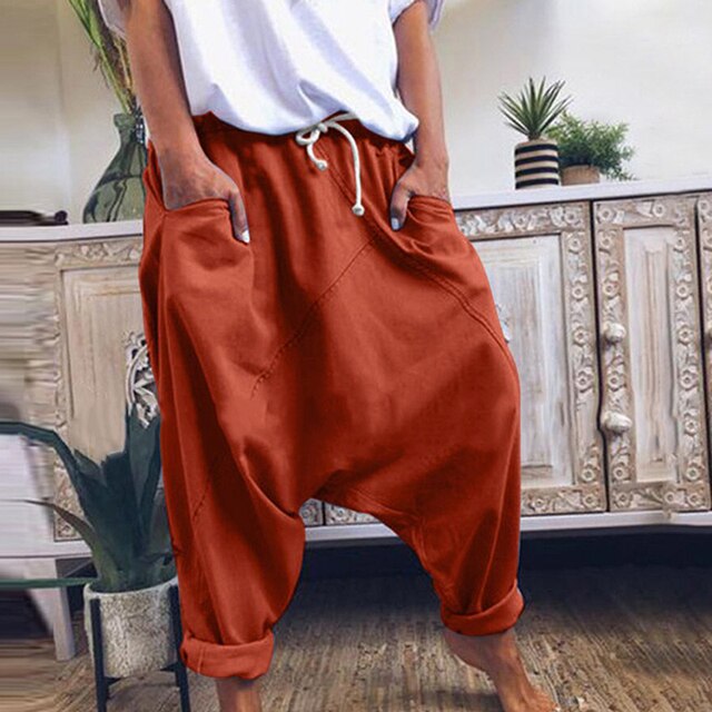 Red men's bohemian harem pants, wide leg & loose fit, offering ultimate comfort & laid-back style.
