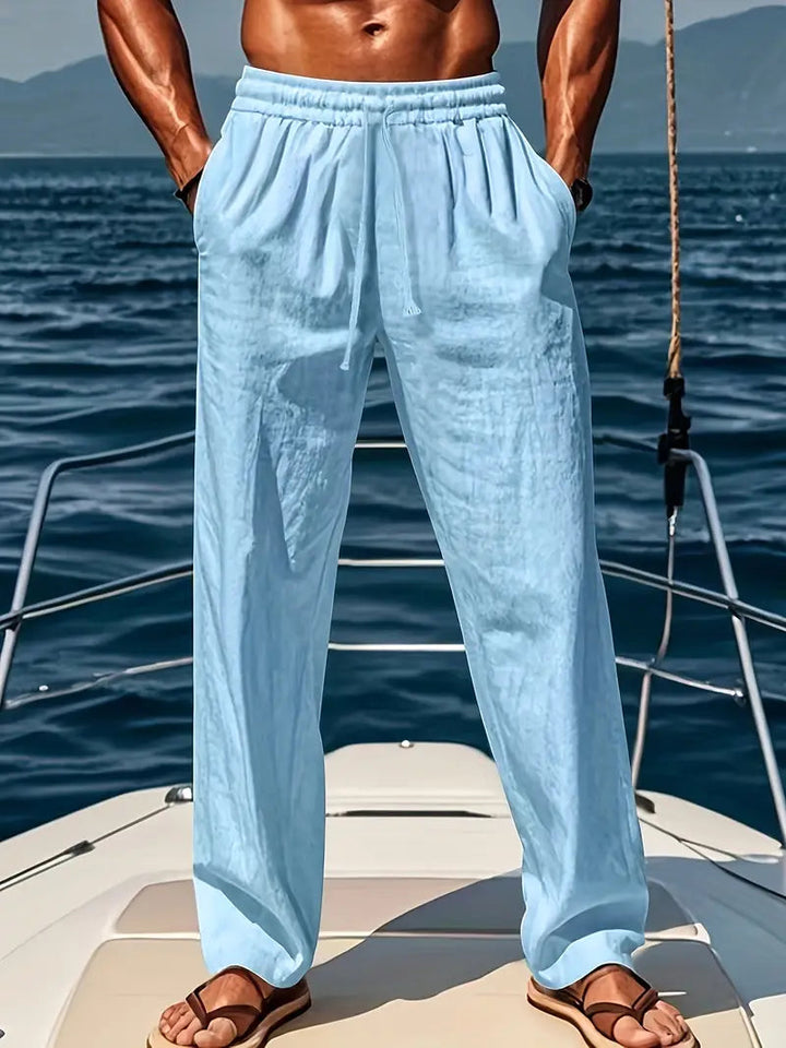 Men's elastic waist drawstring pants. Loose fit, straight leg chino trousers, perfect for casual everyday wear.