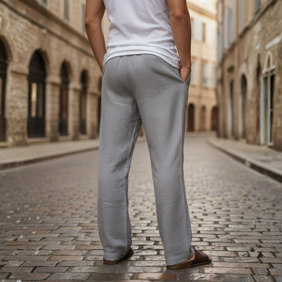 Close-up of men's linen pants with adjustable drawstring waist for a comfortable, baggy fit.